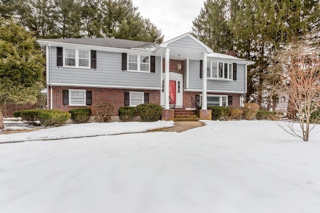 bi-level home with brick siding