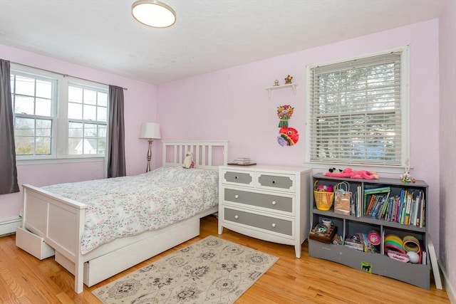 bedroom featuring wood finished floors