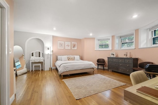 17 Gloucester St Unit A, Boston, MA 02115 - bedroom featuring light wood-type flooring, arched walkways, and recessed lighting