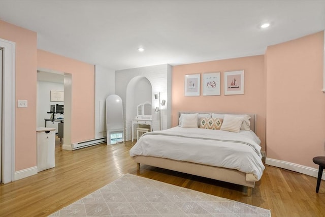 17 Gloucester St Unit A, Boston, MA 02115 - bedroom with light wood-style floors, recessed lighting, and a baseboard heating unit