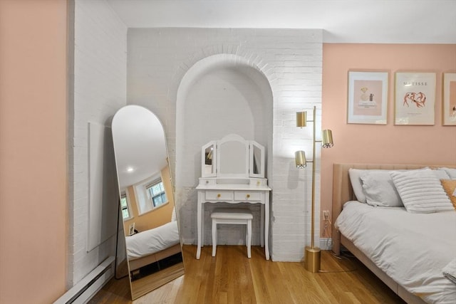 17 Gloucester St Unit A, Boston, MA 02115 - bedroom with wood finished floors and a baseboard heating unit