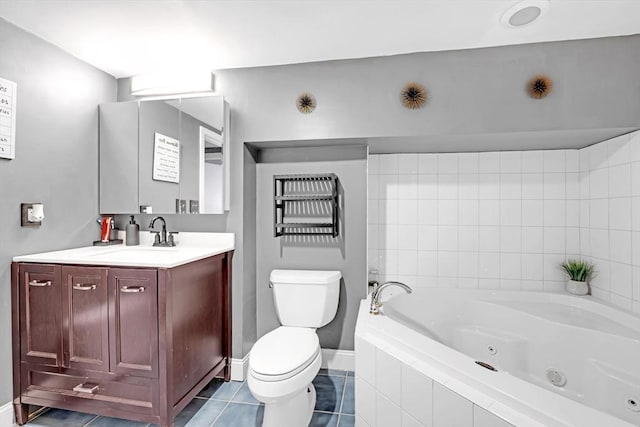 bathroom featuring toilet, a whirlpool tub, tile patterned flooring, baseboards, and vanity