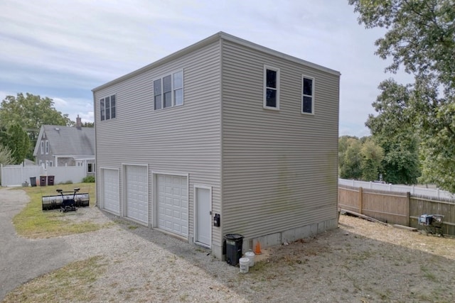 view of side of property with a garage