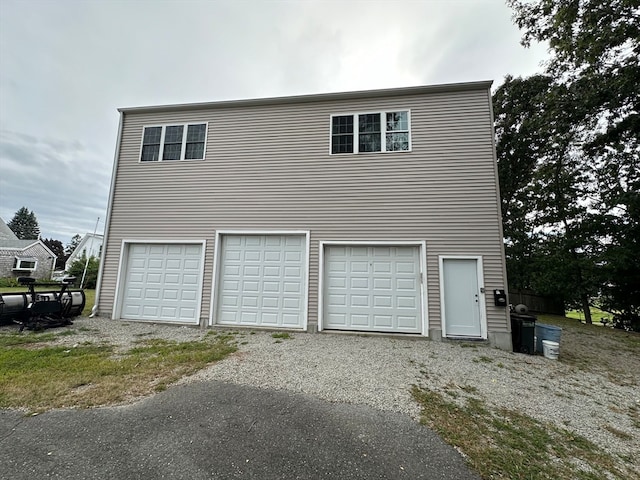 view of property exterior with a garage