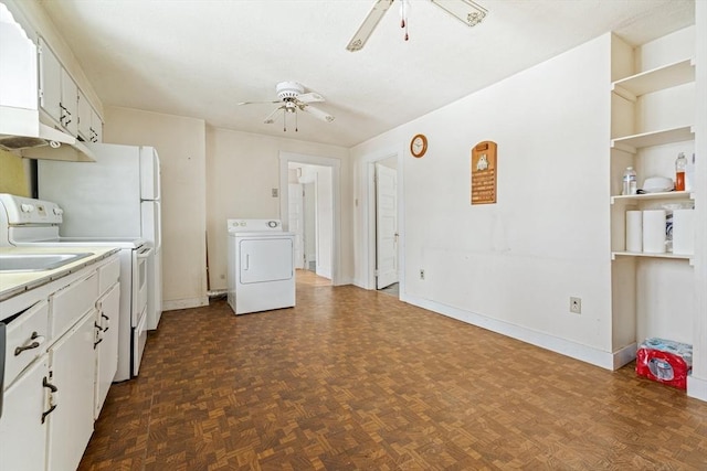 kitchen featuring washer / dryer, light countertops, white cabinets, and ceiling fan