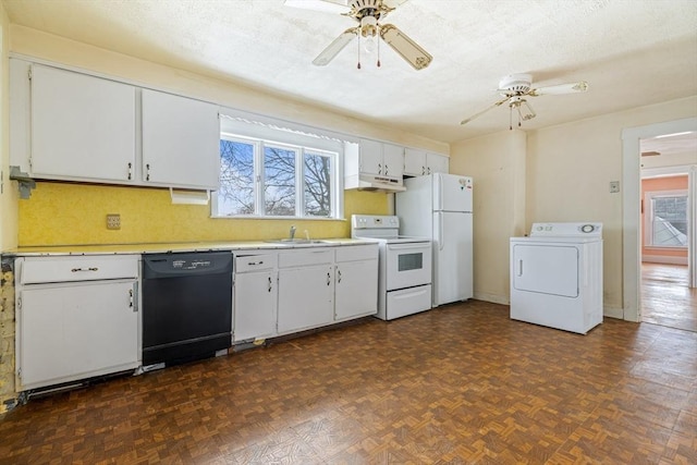 kitchen featuring washer / dryer, white appliances, white cabinets, a ceiling fan, and light countertops