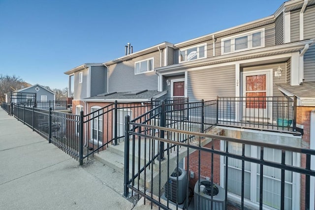 view of front of property with cooling unit