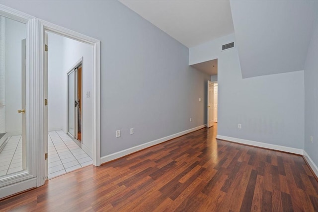 unfurnished room featuring dark hardwood / wood-style floors