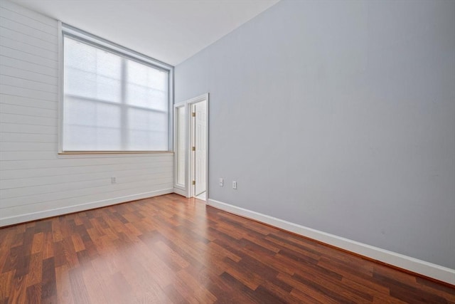 unfurnished room featuring hardwood / wood-style floors