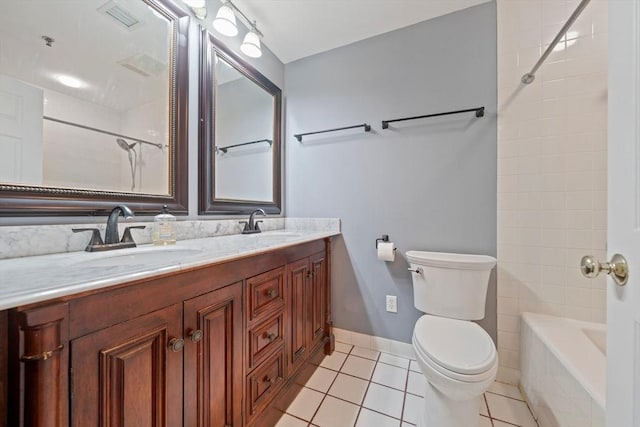 full bathroom featuring vanity, shower / washtub combination, tile patterned floors, and toilet