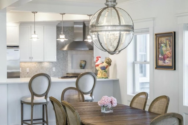 dining room featuring crown molding and a chandelier