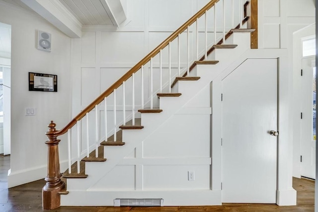 stairs with hardwood / wood-style floors