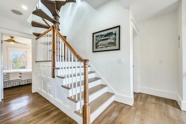 stairway with hardwood / wood-style flooring