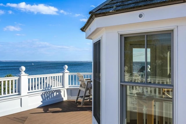 balcony featuring a water view