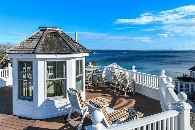 wooden deck featuring a water view