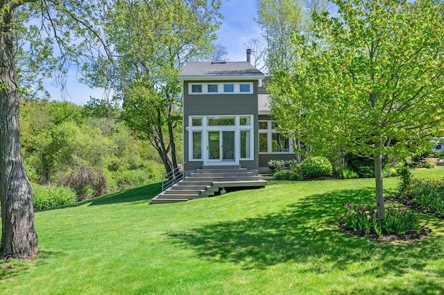 back of house featuring a yard