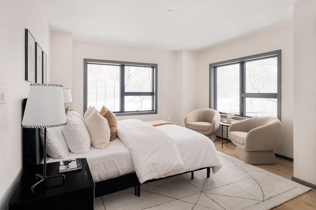 bedroom with light wood-type flooring