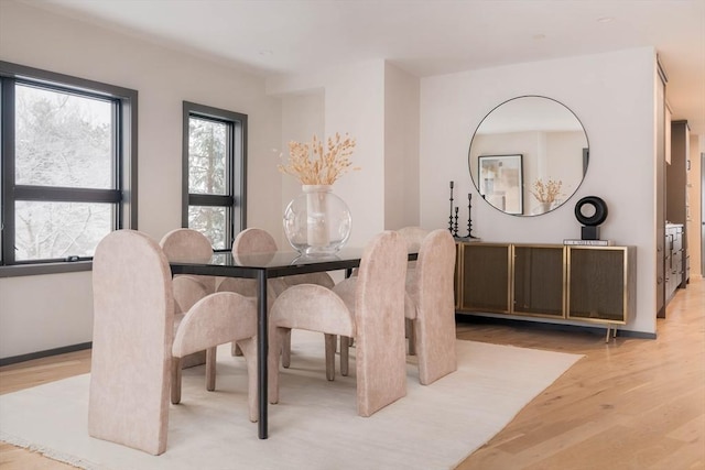 dining room with light wood-type flooring