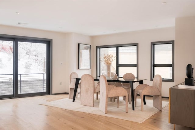 dining room with light hardwood / wood-style floors