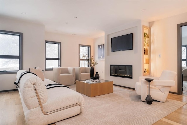 living room with light hardwood / wood-style flooring