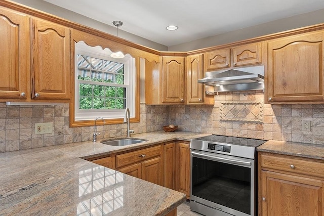 kitchen featuring stainless steel electric range oven, a sink, extractor fan, tasteful backsplash, and light stone countertops
