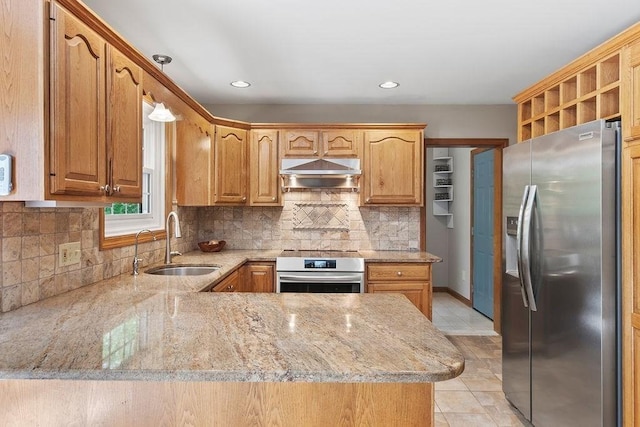 kitchen with stainless steel fridge with ice dispenser, a sink, under cabinet range hood, light stone countertops, and backsplash