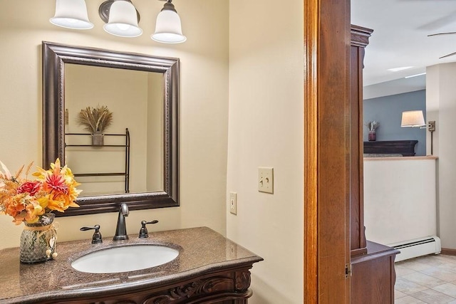 bathroom featuring a baseboard radiator, vanity, and tile patterned flooring