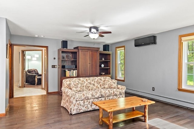 living room featuring a wall mounted AC, a baseboard radiator, plenty of natural light, and ceiling fan