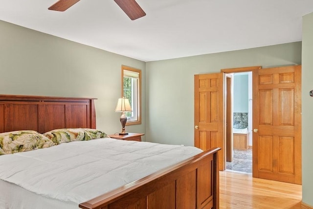 bedroom with light wood-style flooring and a ceiling fan