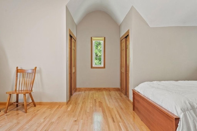 bedroom featuring light wood-style flooring and baseboards