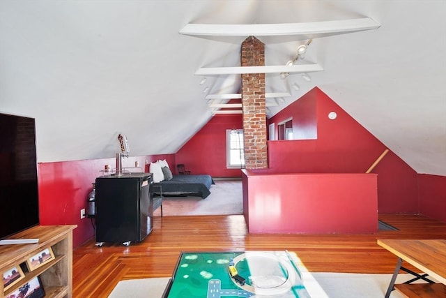bonus room featuring lofted ceiling and wood finished floors