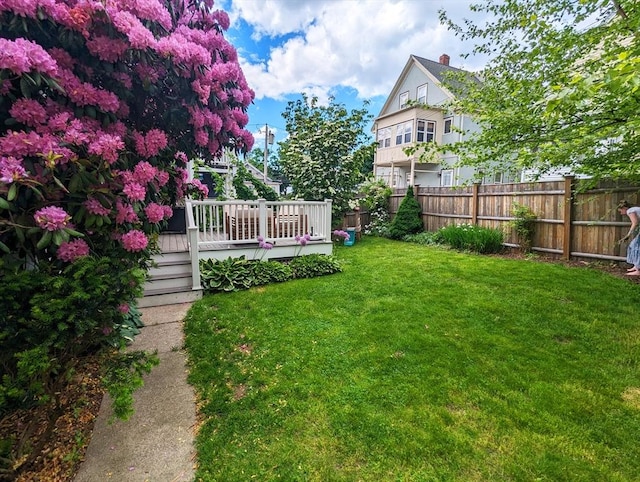 view of yard with a wooden deck