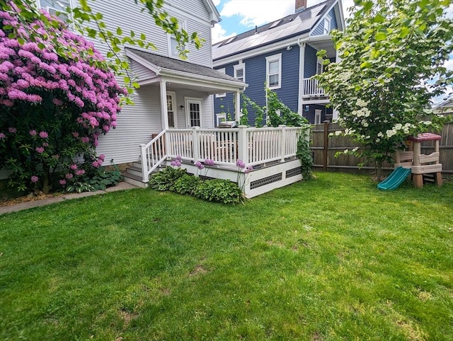 rear view of property with a wooden deck