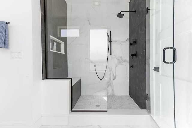 bathroom with a marble finish shower