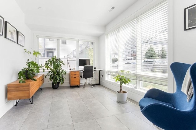office space featuring visible vents, baseboards, and light tile patterned floors