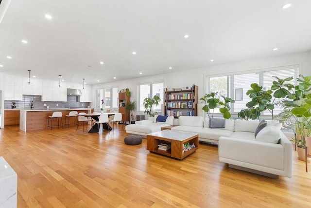 living room featuring light wood-style floors and recessed lighting