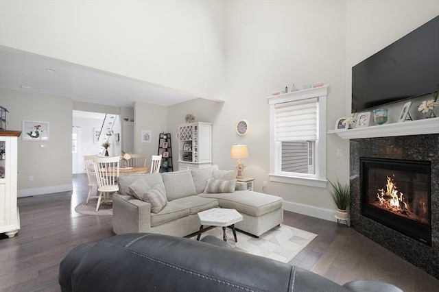 675 Main St Unit C1, Barnstable, MA 02635 - living area with a fireplace, wood finished floors, a high ceiling, and recessed lighting