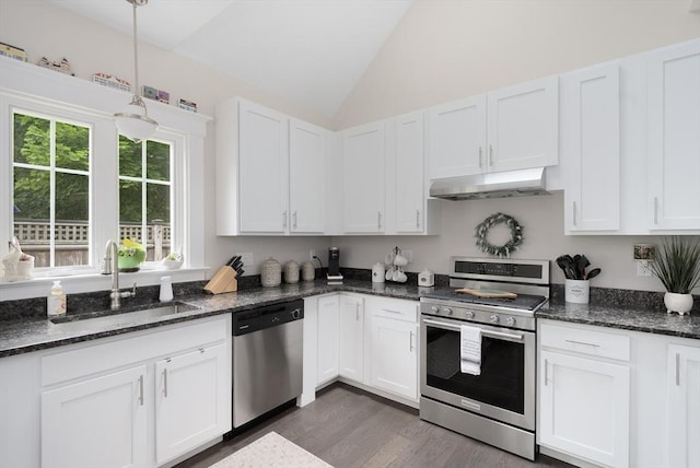 675 Main St Unit C1, Barnstable, MA 02635 - kitchen with appliances with stainless steel finishes, under cabinet range hood, vaulted ceiling, white cabinets, and dark wood finished floors