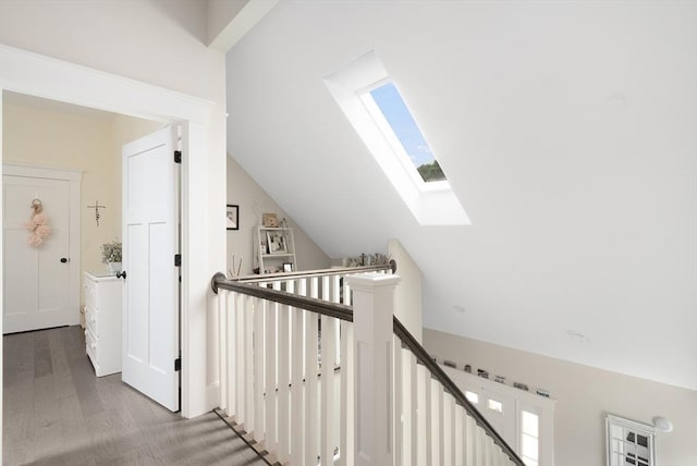 675 Main St Unit C1, Barnstable, MA 02635 - hall with a skylight, vaulted ceiling, wood finished floors, and an upstairs landing