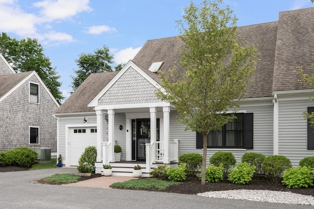 675 Main St Unit C1, Barnstable, MA 02635 - view of front of house with an attached garage, asphalt driveway, and a shingled roof