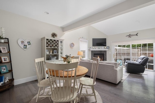 675 Main St Unit C1, Barnstable, MA 02635 - dining room with dark wood-style floors, lofted ceiling, and a fireplace