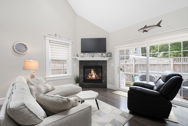 675 Main St Unit C1, Barnstable, MA 02635 - living room featuring high vaulted ceiling, a tile fireplace, and wood finished floors