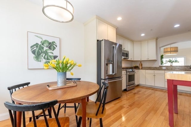 kitchen with recessed lighting, stainless steel appliances, and light wood-style floors