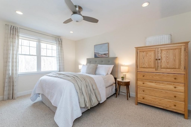 bedroom with recessed lighting, baseboards, light colored carpet, and ceiling fan