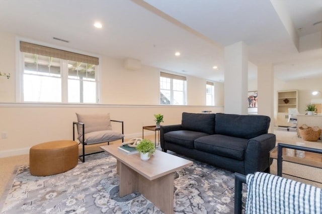 carpeted living room featuring recessed lighting and baseboards