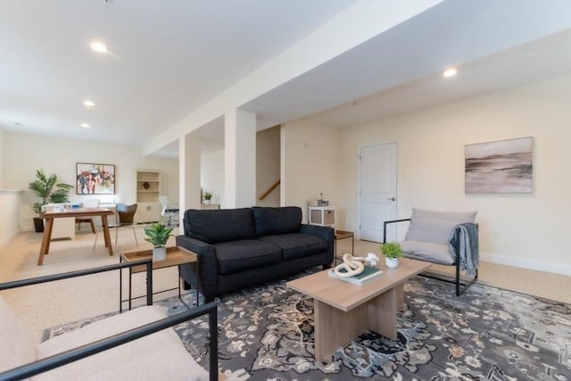 carpeted living area with stairway, recessed lighting, and baseboards