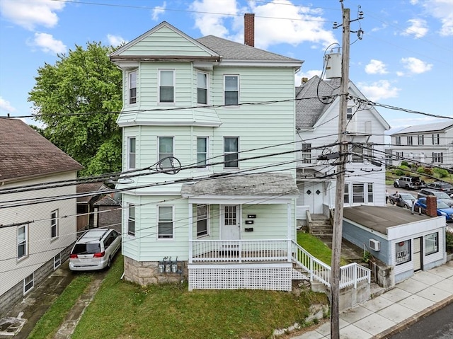 843 Stafford Rd, Fall River, MA 02721 - view of front of house featuring a chimney, a porch, and a shingled roof
