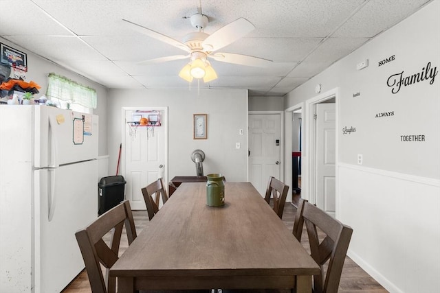 843 Stafford Rd, Fall River, MA 02721 - dining area with wood finished floors, a ceiling fan, and a paneled ceiling