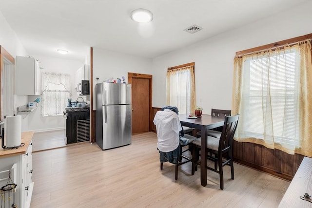 843 Stafford Rd, Fall River, MA 02721 - dining area with light wood-type flooring and baseboards
