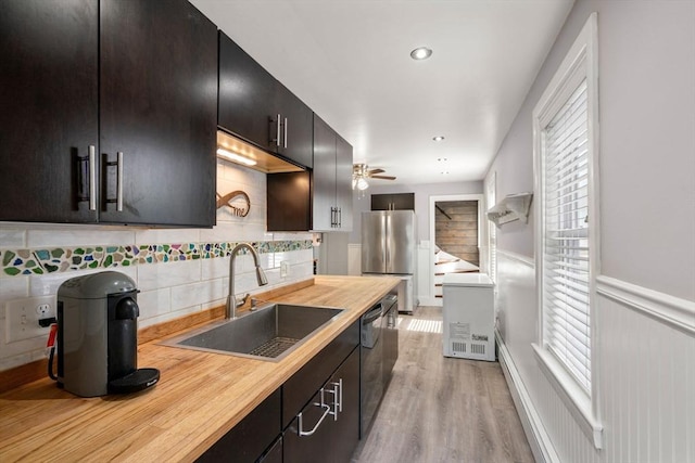 5 Ethel St, Blackstone, MA 01504 - kitchen with freestanding refrigerator, a sink, light wood-style floors, healthy amount of natural light, and a wainscoted wall